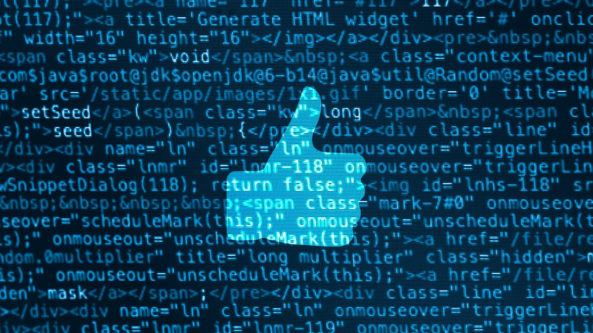 Computer data code screen with thumbs up icon