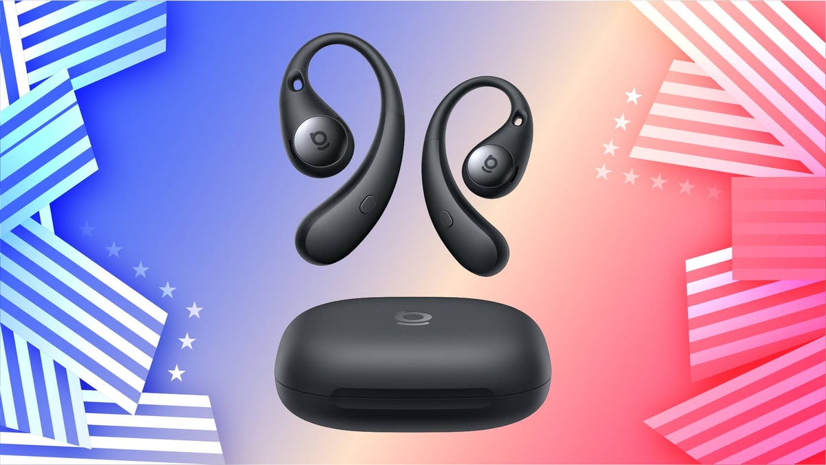 A pair of black earbuds and charging case against a patriotic red, white and blue star and stripe background.