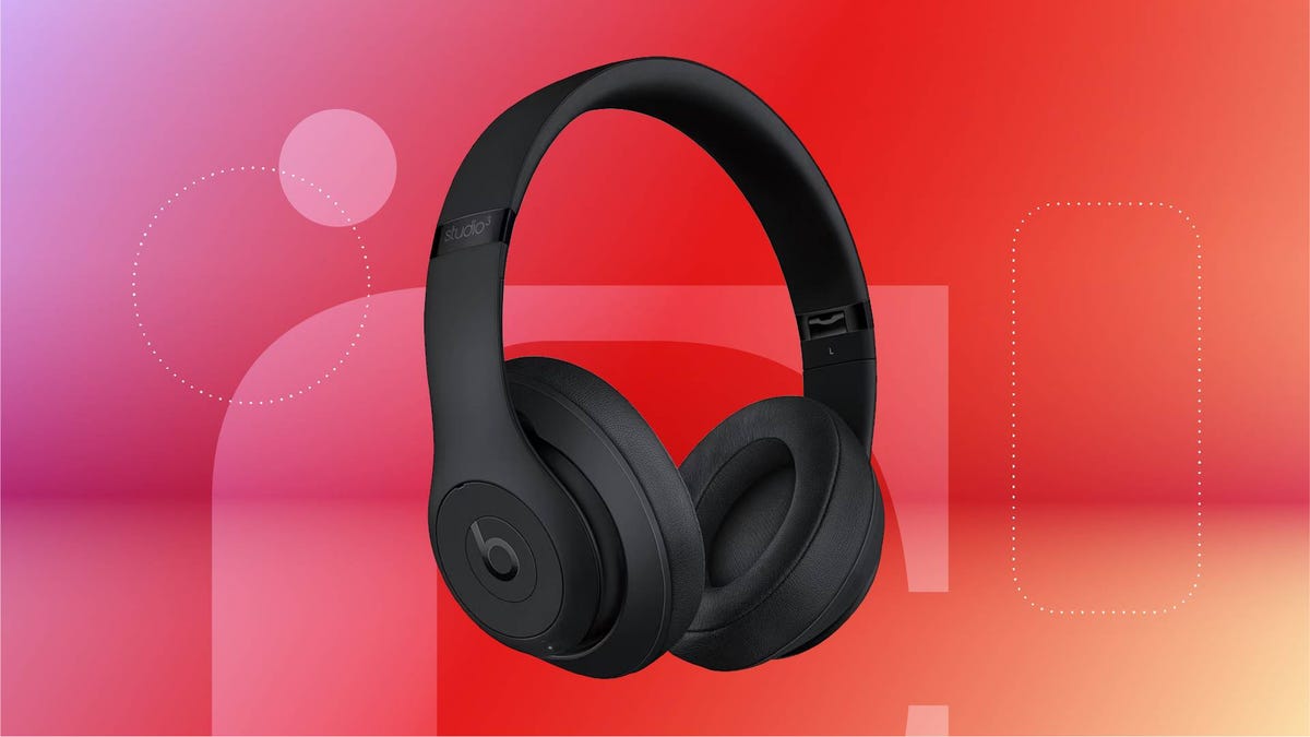 A pair of black headphones against a red gradient CNET background.