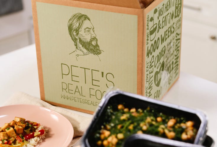 box of pete's food with meals in front