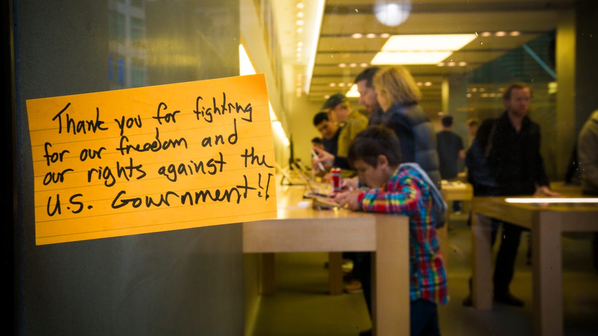 A note supporting Apple hangs on the window of one of the company's San Francisco retail stores.