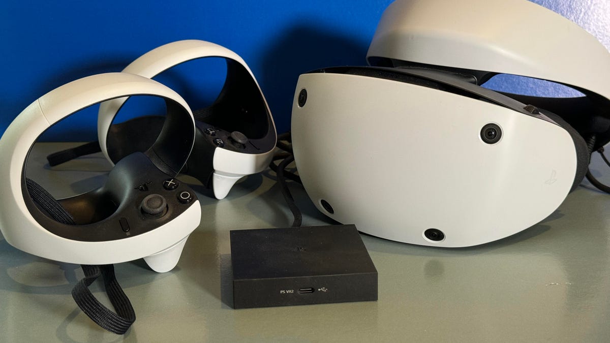 A Sony VR headset with a black adapter box