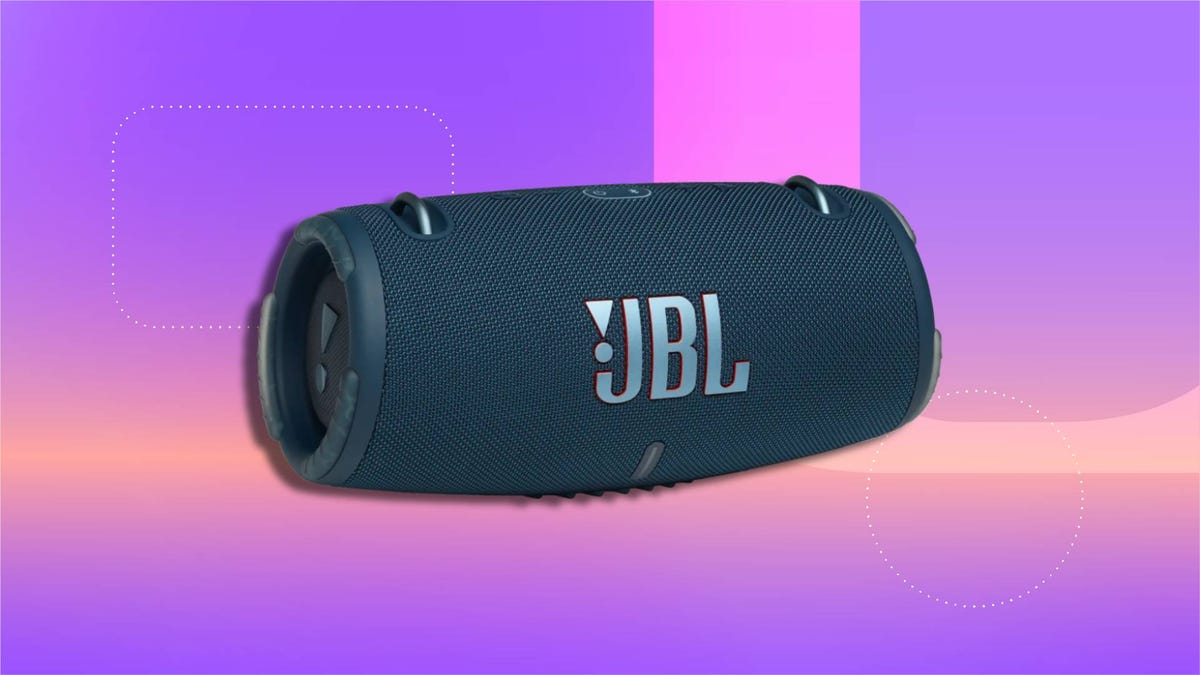 A JBL bluetooth speaker on purple CNET background.