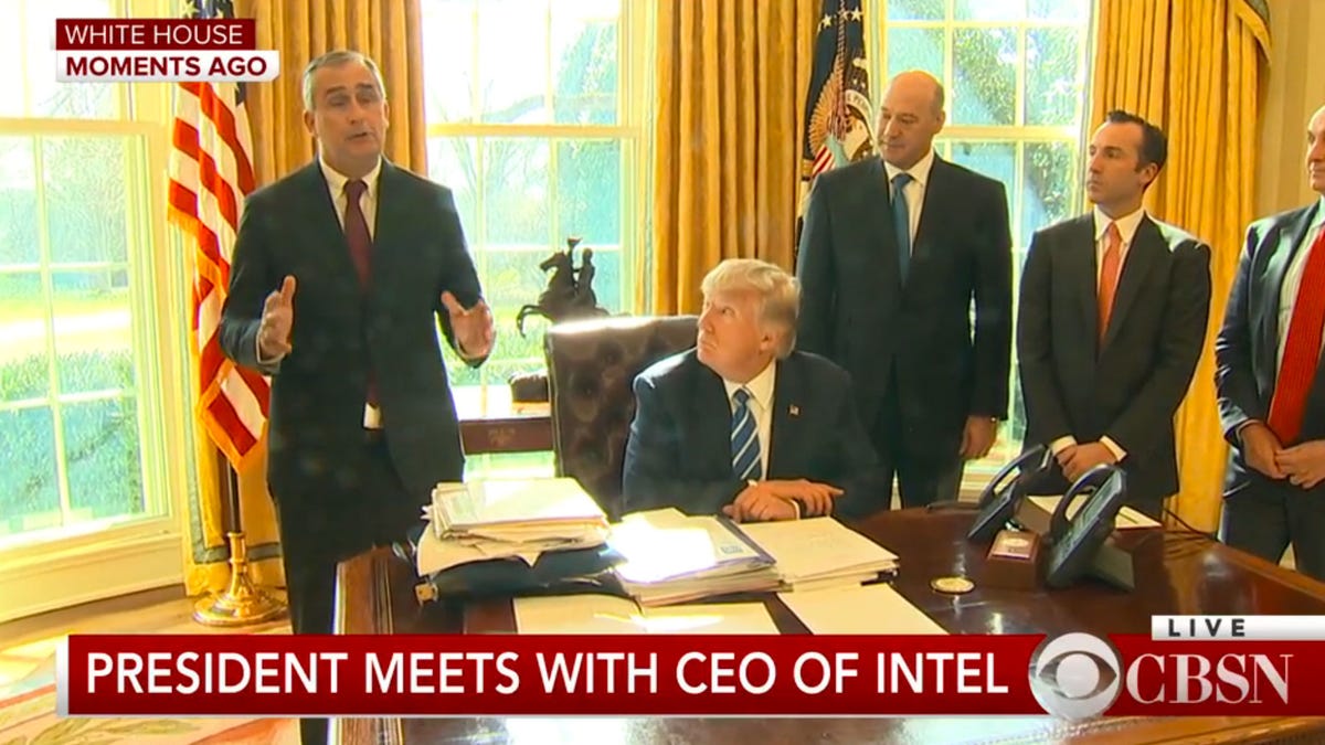 ​Intel CEO Brian Krzanich, left, stands next to President Donald Trump to announce a next-generation chip factory.