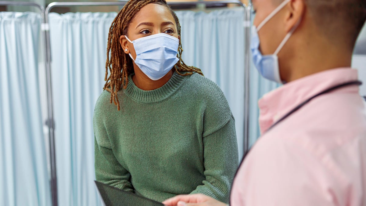 A woman having a medical consultation with a doctor