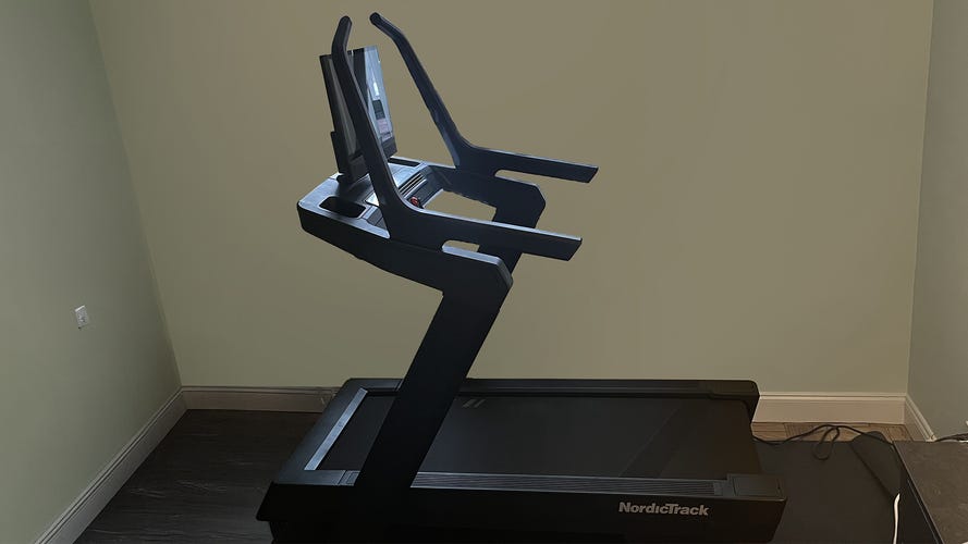 NordicTrack X24 treadmill on a black mat