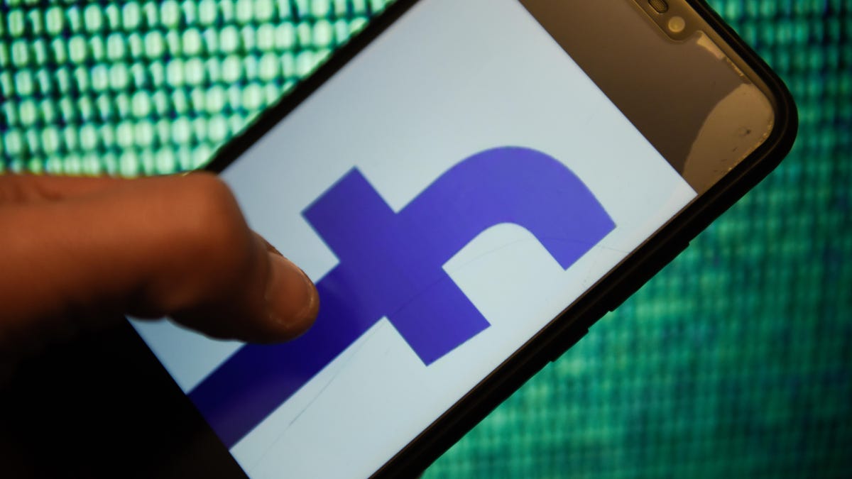 Facebook logo is seen on an android mobile phone