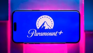 paramount plus logo on phone on neon pink background
