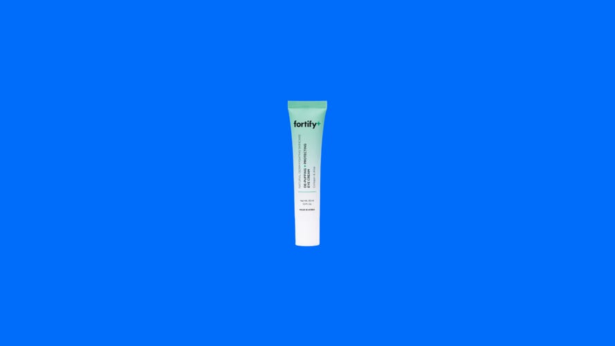 Fortify De-Puffing and Protecting eye cream on colorful background.