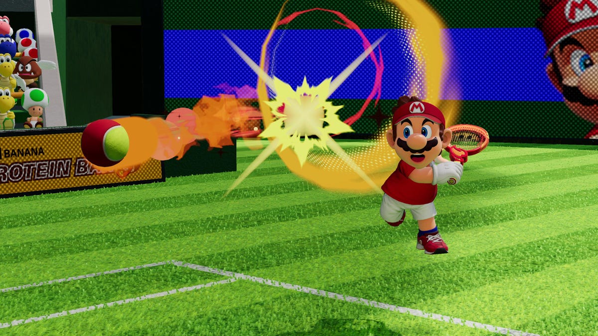 Mario volleying a firey ball on a court in Mario Tennis Fever