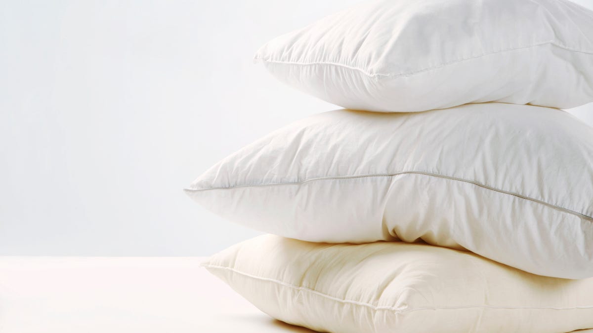 A pile of three white pillows.