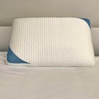 Bear Pillow on a white bed