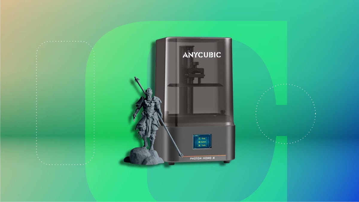 An Anycubic 3D printer on a bright green background.