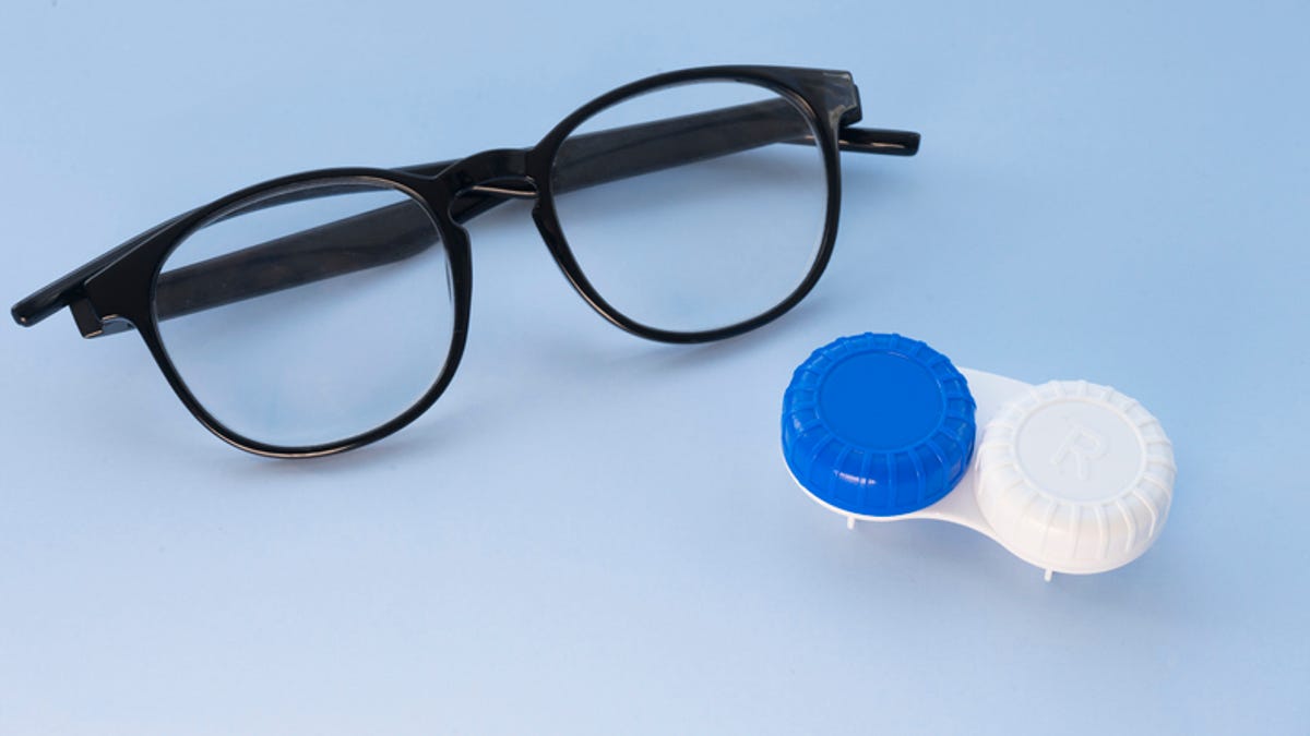 pair of glasses and contact lens case