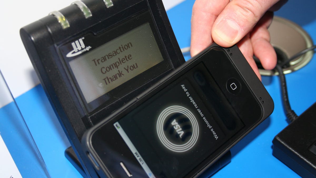 Phones with a special microSD memory card and Visa's PayWave mobile app can be used to make transactions by holding the device near a reader.