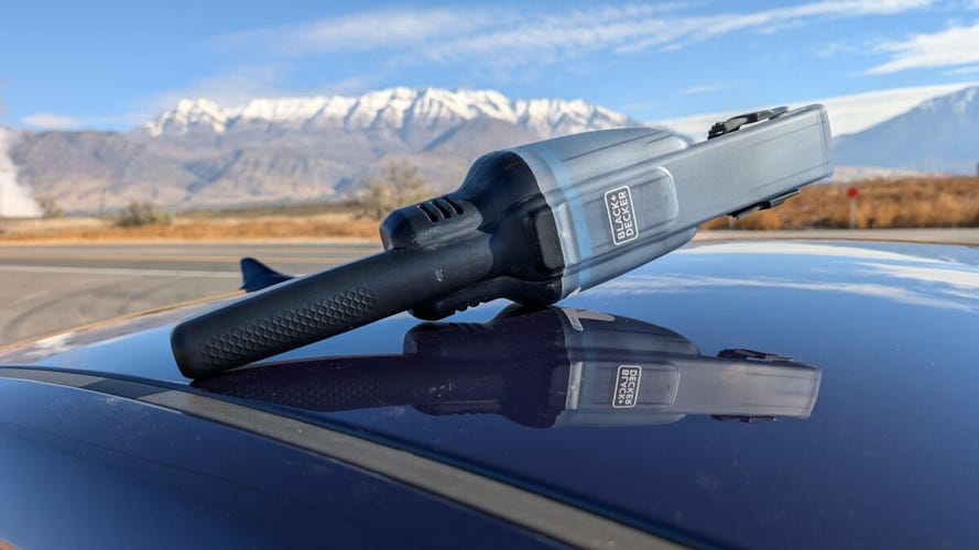 black decker dustbuster on roof of car