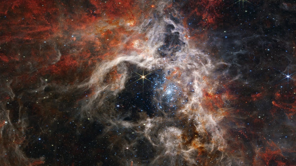 Swirling, ghostly view of the Tarantula Nebulas has a thick web-like appearance of gas, dust and stars.