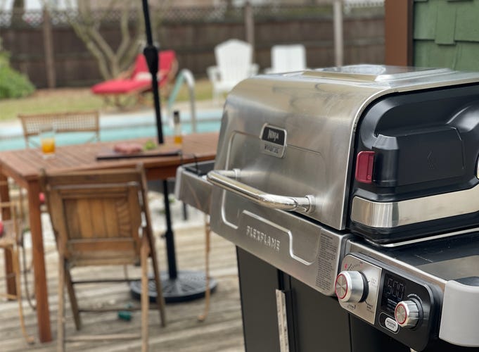 grill in front of pool