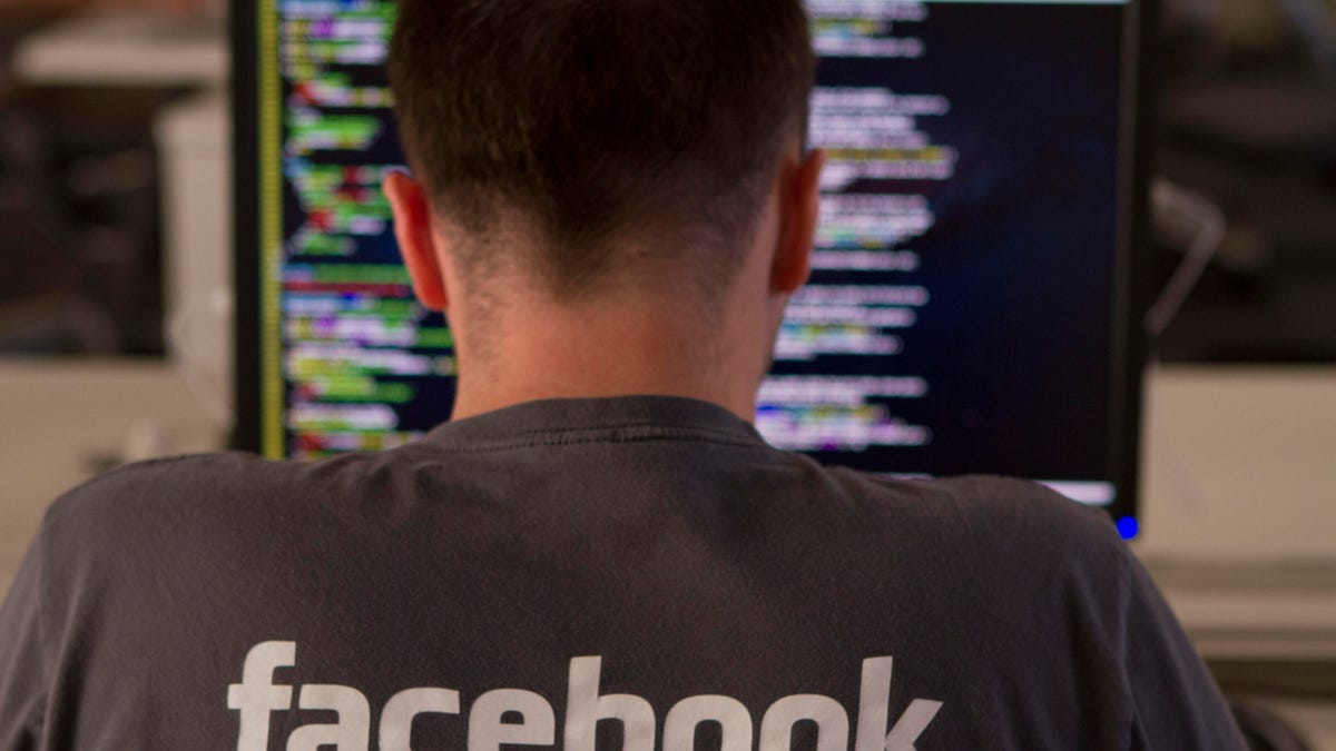 A new employee sits at a computer during Facebook's engineering bootcamp