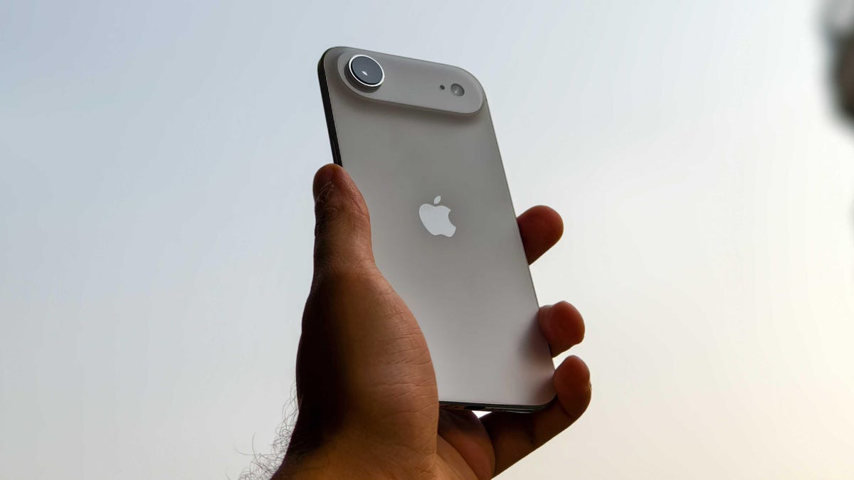 Prakhar Khanna holding the iPhone Air.