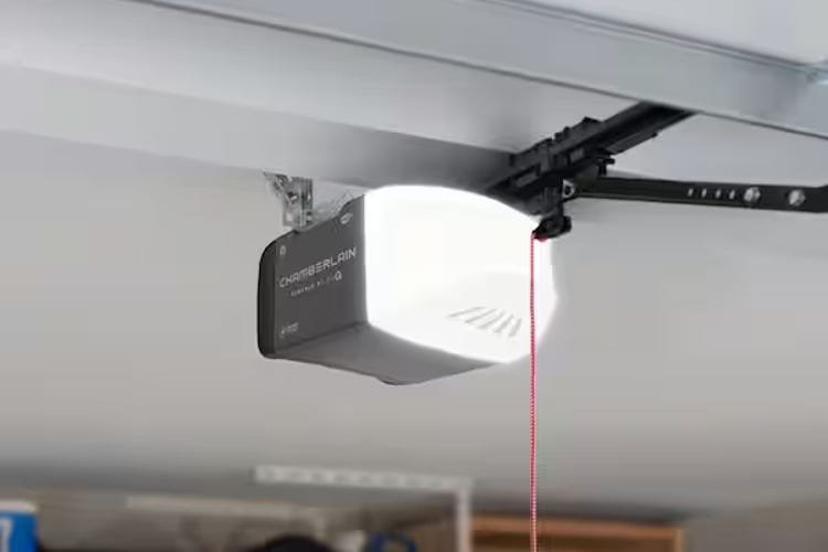 A Chamberlain motor mounted and lit in a garage door. 