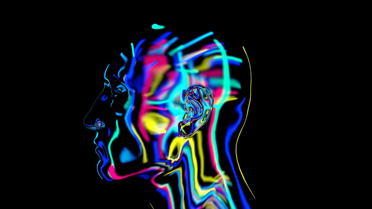 An image of a person's head with colorful lights piercing through