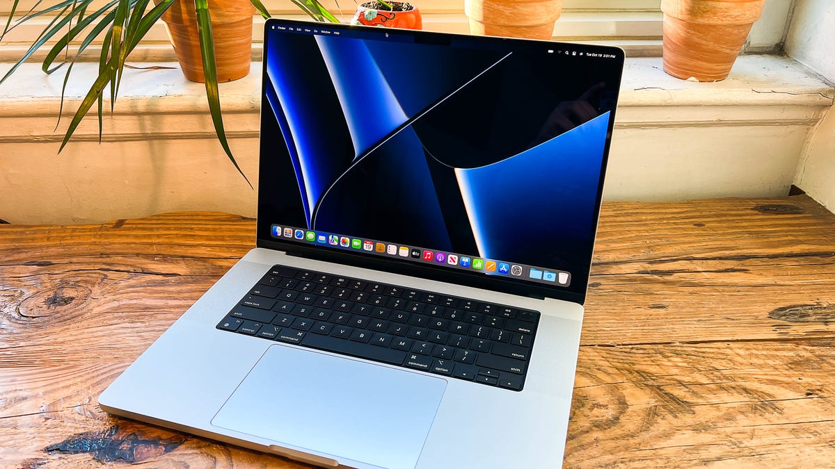 The 16-inch MacBook Pro from 2021 on a wooden table