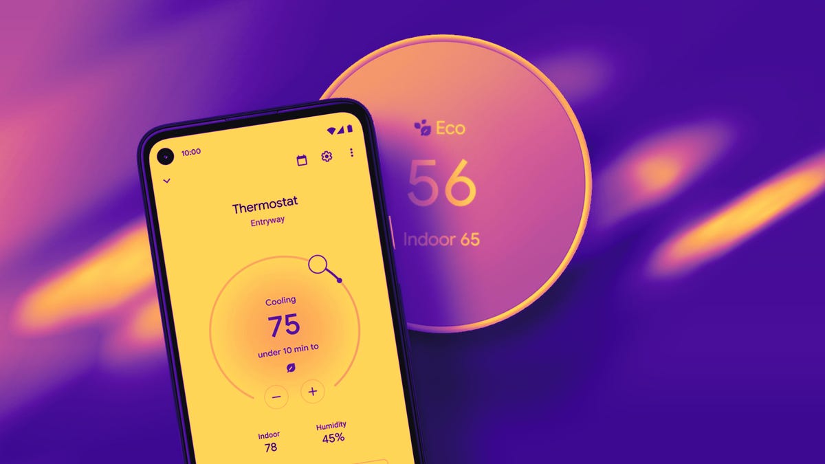 Google thermostat on a red wall