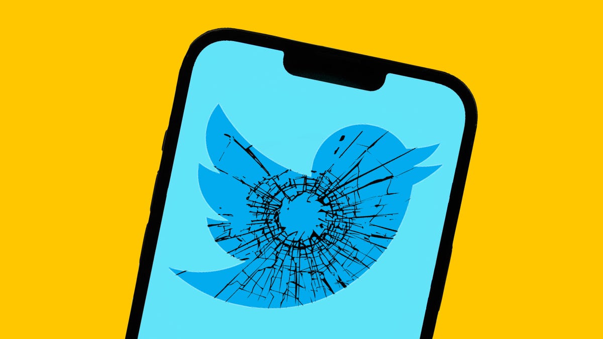 Twitters logo on a phone, with the imagery of a gunshot shattering the glass