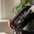 person pouring bottle using coravin system