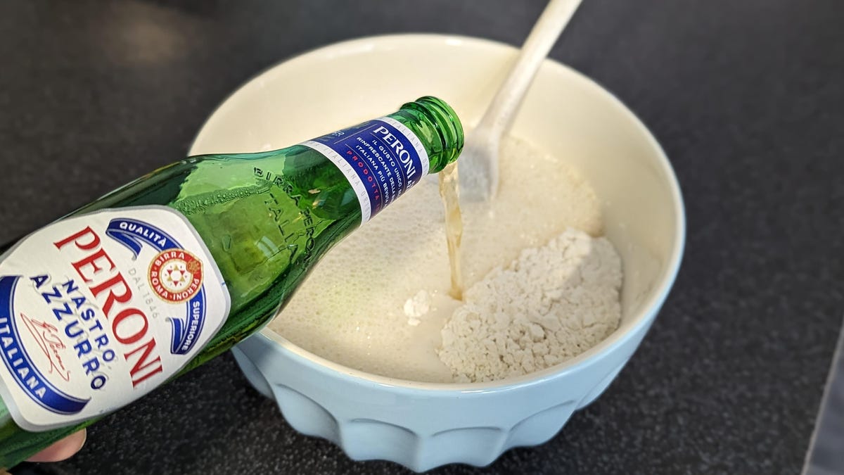 adding peroni beer to flour mixture