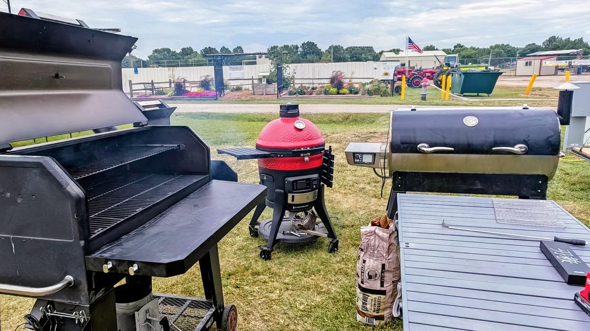 A Recteq Flagship 1400 XL, Kamado Joe Konnected Joe, and Nexgrill Oakford Reverse Flow charcoal smoker warming up.