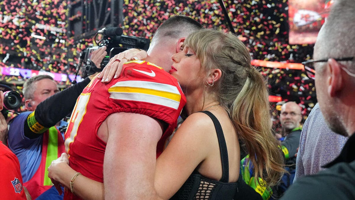 Travis Kelce hugging Taylor Swift after Super Bowl 58