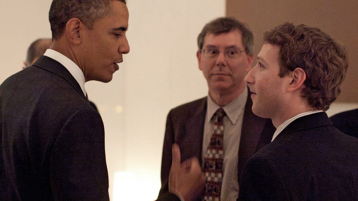 President Barack Obama talks with Facebook founder and CEO Mark Zuckerberg