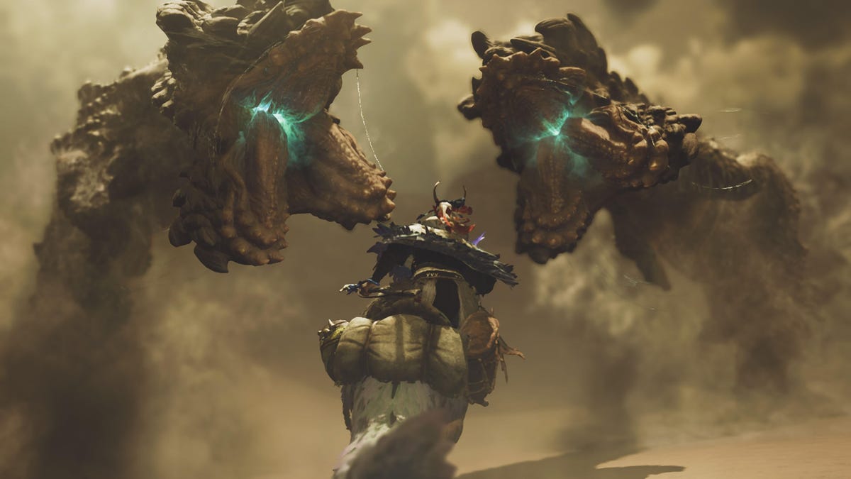 Two giant worms veer toward a hunter riding a mount.
