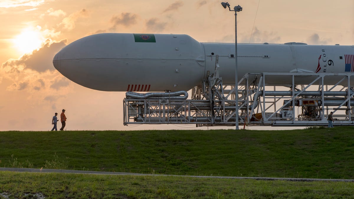 SpaceX's Falcon 9 rocket is moved to a launch pad before a launch attempt in 2015.