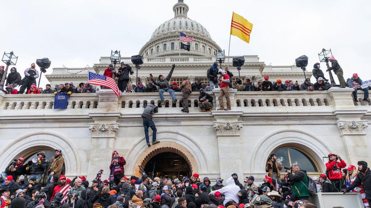 A mob swarms the US Capitol on Jan. 6