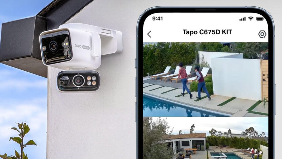 Tapo's dual camera on a white exterior wall with a phone showing views from the cam.