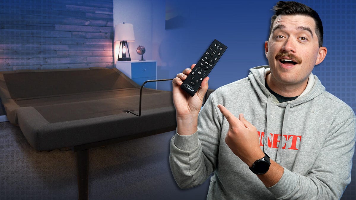 The TEMPUR-Ergo PROSMART Base against a colorful background and a man in a CNET sweatshirt in the front.