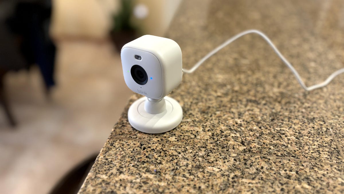The Blink Mini 2 sits at the edge of a counter.