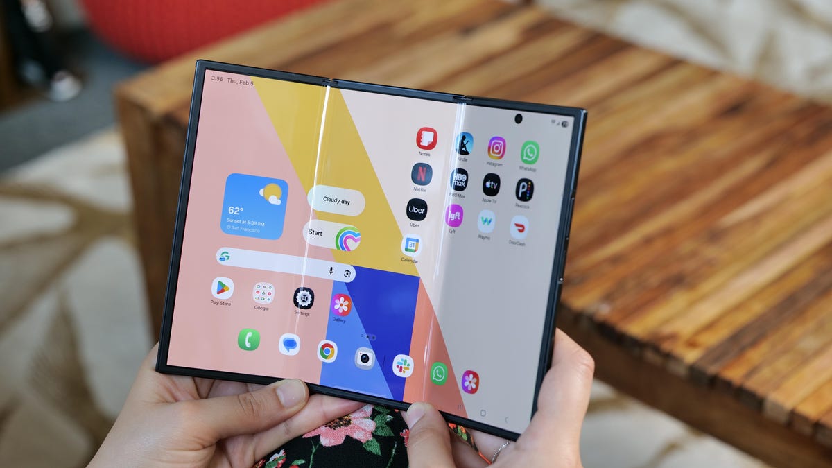 The Galaxy Z TriFold phone fully opened, with its screen showing app icons