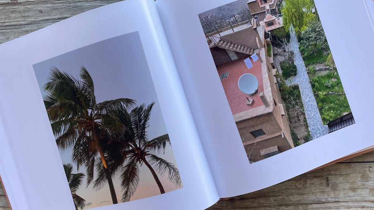 An image of the inside of a photo book featuring buildings and palm trees