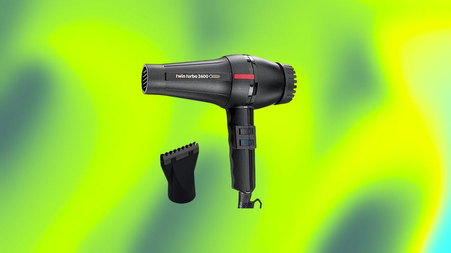 The Twin Turbo 2600 with its concentrator attachment over an abstract green background.