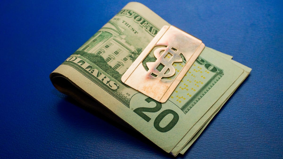 005-stimulus-piggy-bank-tear-falling-money-clip-weighing-cash-scale