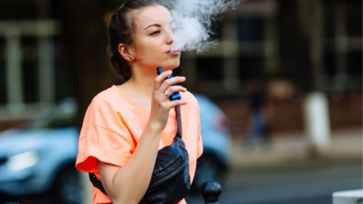 Young woman vaping