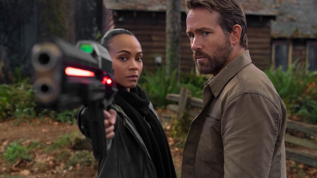 Zoe Saldana and Ryan Reynolds take aim in The Adam Project on Netflix.