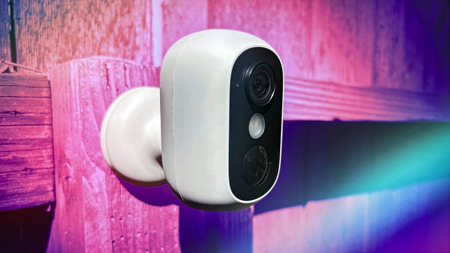 A Eufy cam on a fence with CNET highlights.