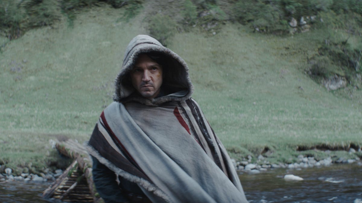 Cassian Andor wears a poncho and looks intense in Andor