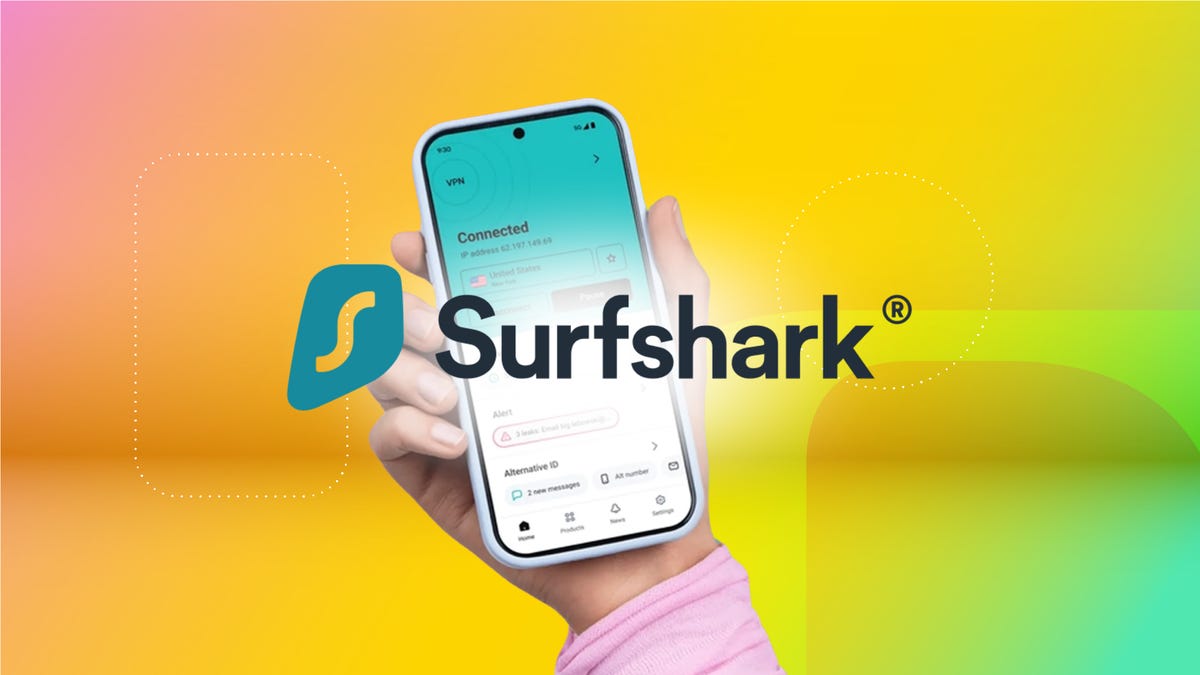 A hand holds a phone with Surfshark open and the Surfshark logo is laid on top of this. It is also on a gradient orange CNET background.