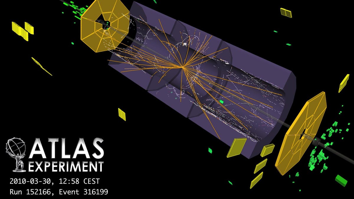 Some of the first tracks of particles created by protons colliding show toward the center of this computer view of an LHC experiment called Atlas.